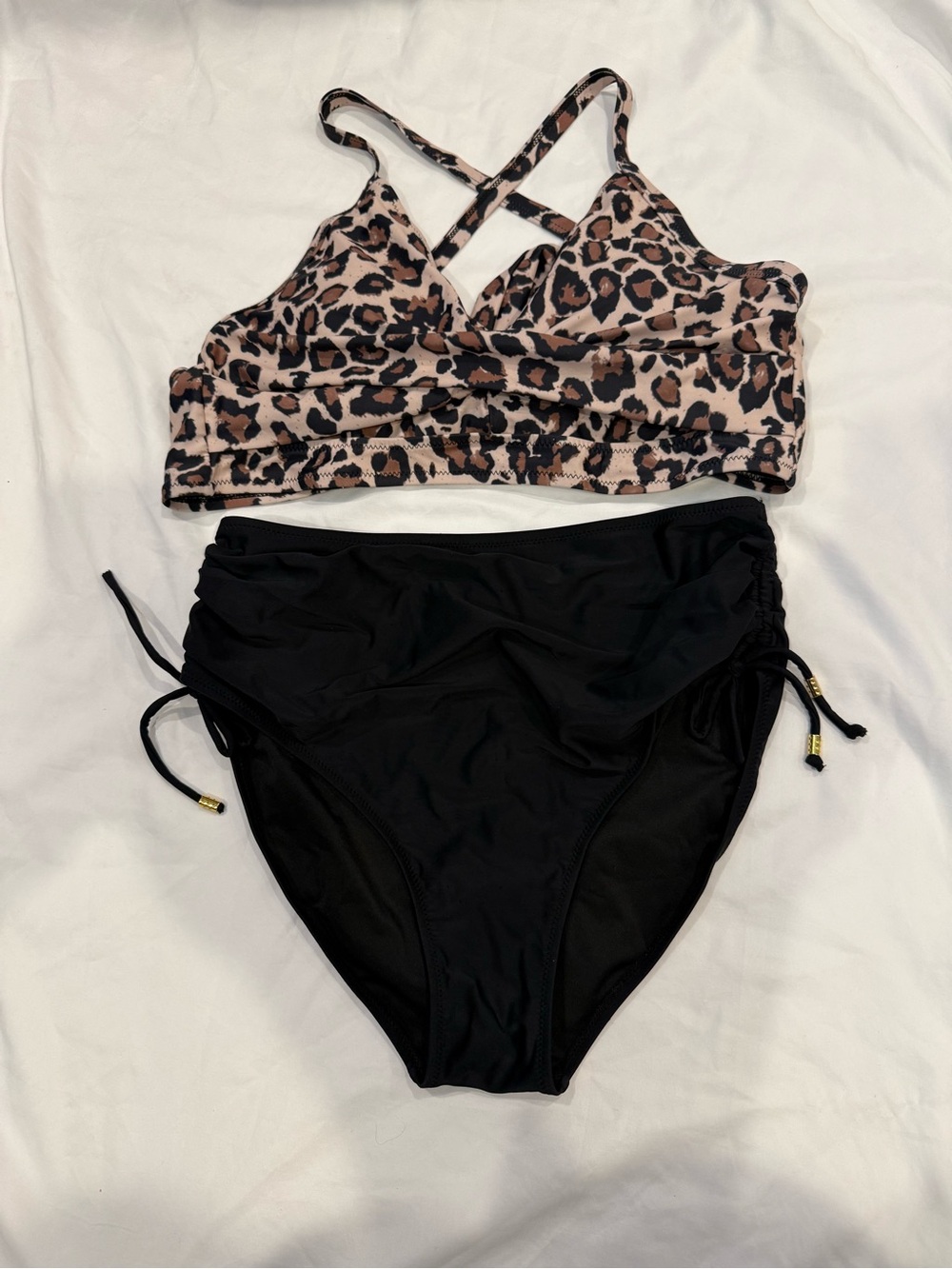Women’s size L Bikini Leopard Print Tie-Back top and black high waist bottoms.